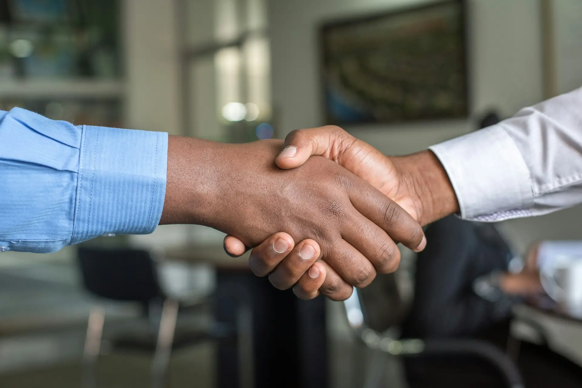 The founding of Sign Architects in 2015 with a vision for innovative signage Professional handshake symbolising the founding of Sign Architects in 2015