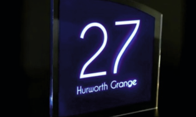 A custom-made illuminated door number plaque, designed for clear visibility and professional aesthetics in commercial and residential spaces. Illuminated acrylic door number plaque for a modern business.