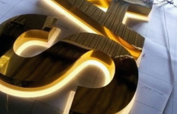 Elegant mirror and brushed-finish signage that adds a touch of luxury and professionalism to business branding. Gold mirror-finish signage with brushed metal effect.