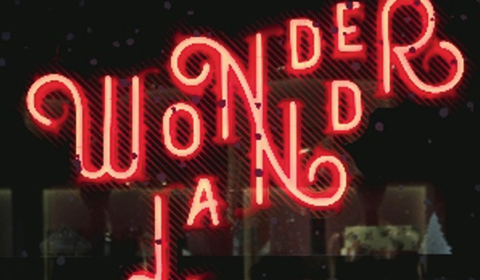 A stylish neon-illuminated sign spelling 'Wonderland,' designed for eye-catching branding with an artistic touch. Bright red neon-illuminated Wonderland sign at night.