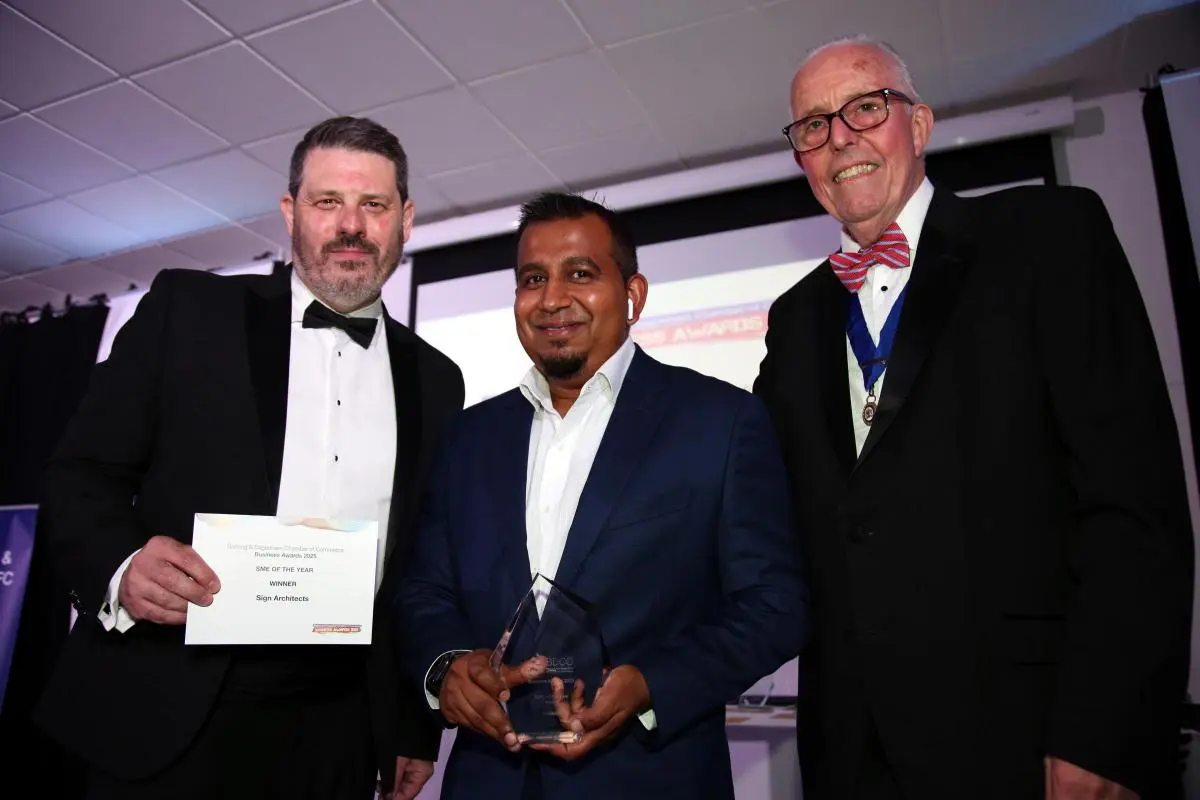 Yusuf Rab of Sign Architects receiving the Business Growth and SME of the Year awards at the Barking & Dagenham Chamber of Commerce Awards 2025, with event hosts.